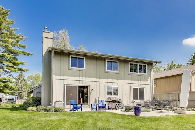 609 Bryce Trl, Roselle, IL 60172 - rear view of house featuring a chimney, a patio, and a lawn