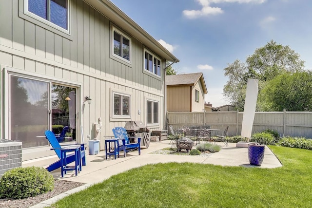 609 Bryce Trl, Roselle, IL 60172 - rear view of house featuring a patio area, central AC unit, and an outdoor fire pit