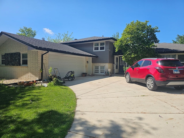 8554 Fir St, Orland Park, IL 60462 - back of property featuring brick siding, a garage, driveway, and a yard