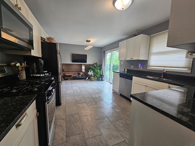 8554 Fir St, Orland Park, IL 60462 - kitchen featuring appliances with stainless steel finishes, a sink, white cabinetry, and open floor plan