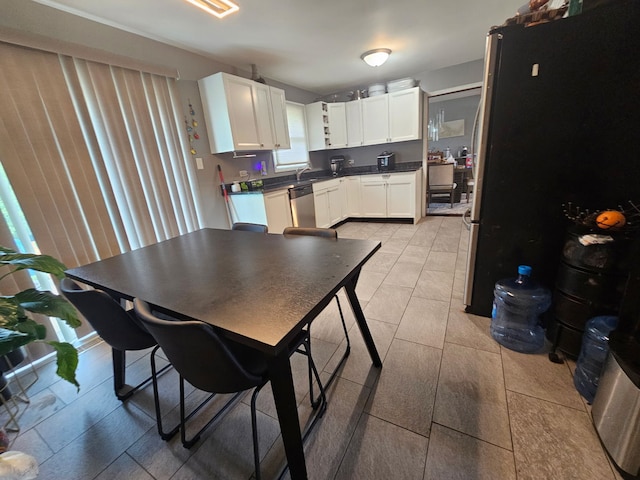 8554 Fir St, Orland Park, IL 60462 - kitchen with appliances with stainless steel finishes, white cabinets, dark countertops, and a sink