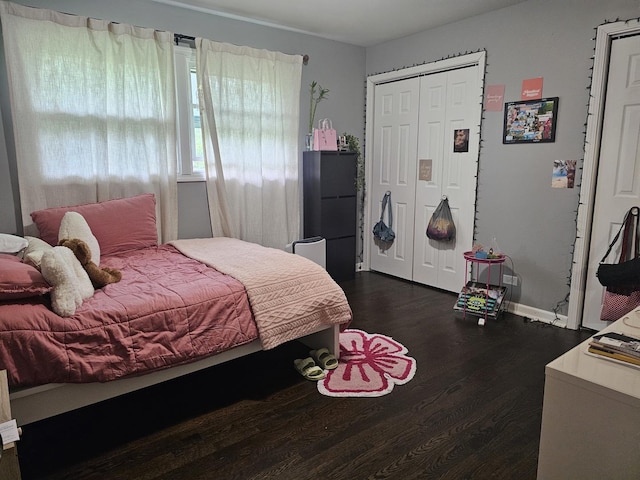 8554 Fir St, Orland Park, IL 60462 - bedroom with dark wood-style floors, a closet, and baseboards