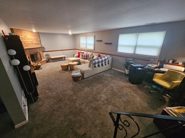8554 Fir St, Orland Park, IL 60462 - carpeted living area featuring a stone fireplace and baseboards