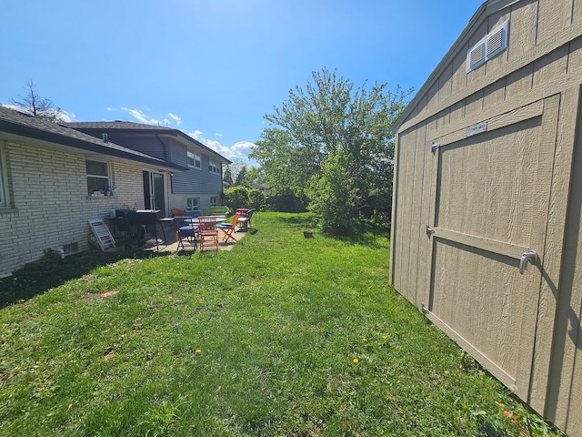 8554 Fir St, Orland Park, IL 60462 - view of green lawn featuring a patio area and an outdoor fire pit