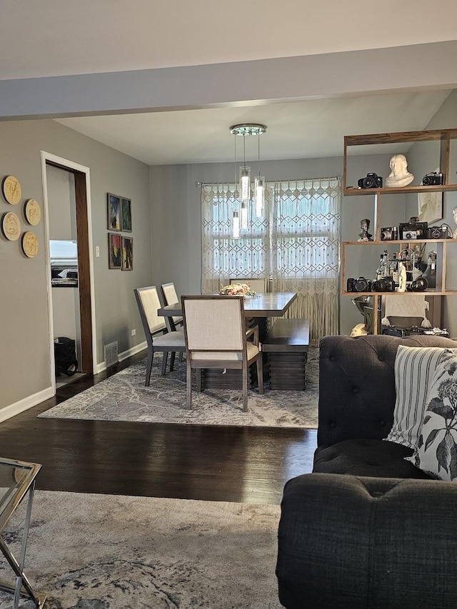8554 Fir St, Orland Park, IL 60462 - dining room featuring wood finished floors, a chandelier, and baseboards