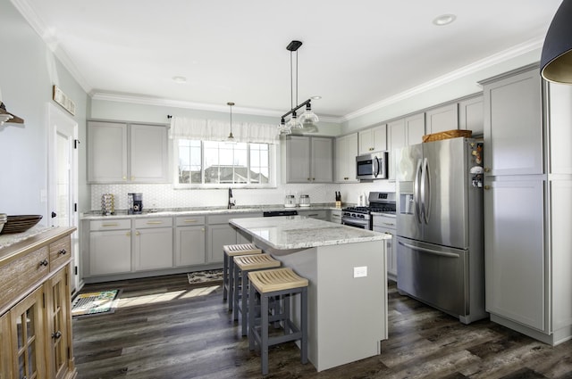 27363 W Macura St, Channahon, IL 60410 - kitchen featuring appliances with stainless steel finishes, gray cabinets, tasteful backsplash, crown molding, and recessed lighting