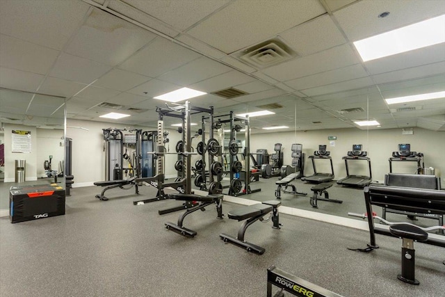 workout area featuring a drop ceiling
