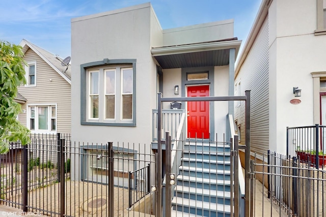 2636 W Grand Ave, Chicago, IL 60612 - view of front of home with stucco siding and fence