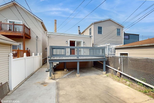 2636 W Grand Ave, Chicago, IL 60612 - rear view of property featuring a wooden deck and fence