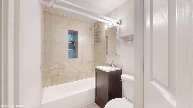 2636 W Grand Ave, Chicago, IL 60612 - bathroom featuring toilet, vanity, and bathing tub / shower combination