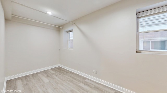 2636 W Grand Ave, Chicago, IL 60612 - empty room featuring light wood-style flooring and baseboards