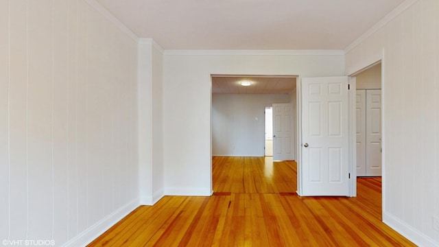 2636 W Grand Ave, Chicago, IL 60612 - corridor featuring light wood-style flooring, baseboards, and ornamental molding