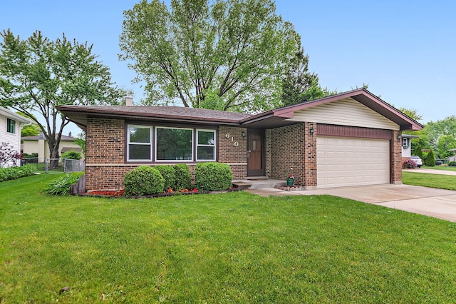 610 Catalpa Ln, Bartlett, IL 60103 - view of front of property featuring brick siding, a garage, concrete driveway, and a chimney