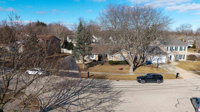 1184 Princeton Dr, Bartlett, IL 60103 - view of front of property with a residential view, driveway, an attached garage, and a front yard
