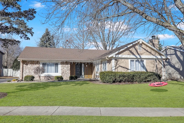 1184 Princeton Dr, Bartlett, IL 60103 - ranch-style house featuring a front yard, a chimney, and stone siding