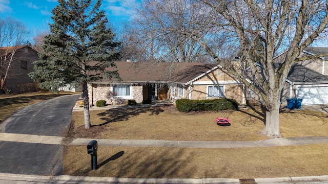 1184 Princeton Dr, Bartlett, IL 60103 - ranch-style home with driveway, a front yard, and stone siding