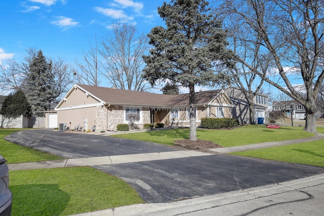 1184 Princeton Dr, Bartlett, IL 60103 - view of front of property with a front yard, stone siding, asphalt driveway, and a garage