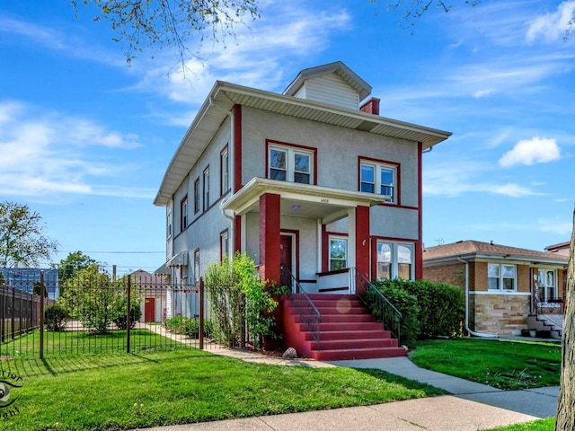 american foursquare style home featuring stucco siding