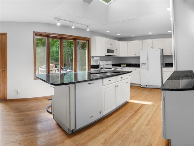 7417 N Hill Rd, Marengo, IL 60152 - kitchen featuring white appliances, white cabinets, light wood-style floors, recessed lighting, and a center island with sink
