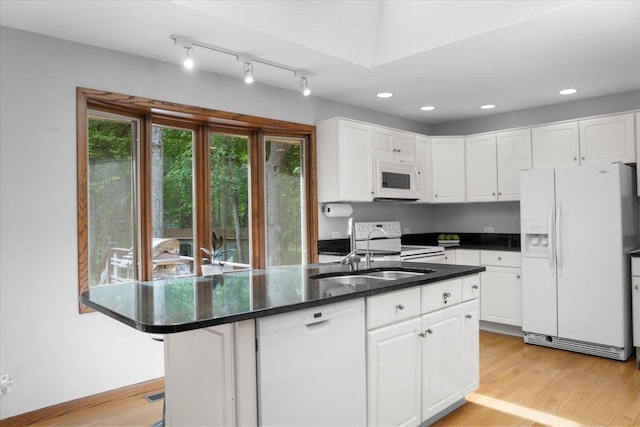 7417 N Hill Rd, Marengo, IL 60152 - kitchen with white appliances, white cabinets, a sink, light wood-style floors, and recessed lighting