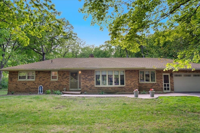 7417 N Hill Rd, Marengo, IL 60152 - ranch-style home with a garage, brick siding, and a front yard