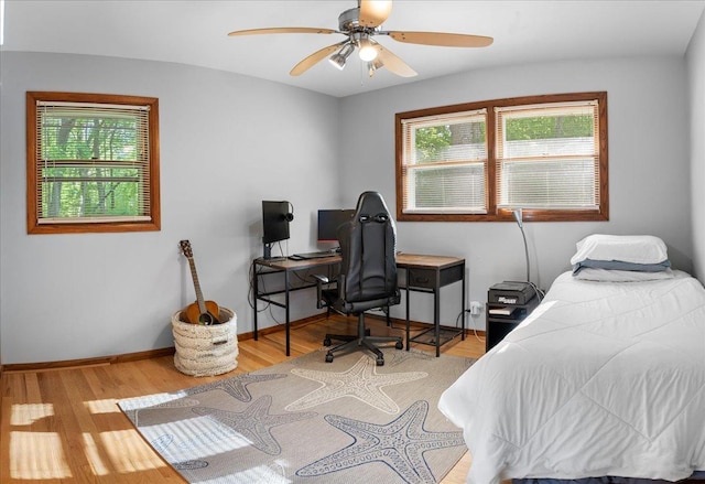 7417 N Hill Rd, Marengo, IL 60152 - bedroom featuring wood finished floors, baseboards, a desk, and a ceiling fan