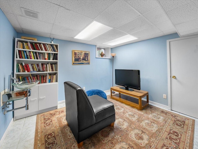 7417 N Hill Rd, Marengo, IL 60152 - living area with a drop ceiling and baseboards
