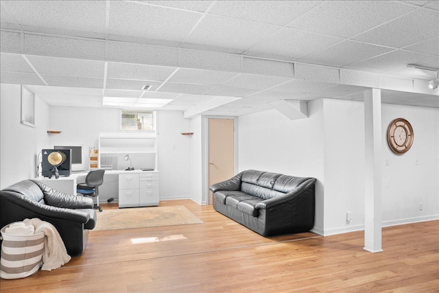7417 N Hill Rd, Marengo, IL 60152 - living room with light wood-style floors, a desk, baseboards, and a drop ceiling