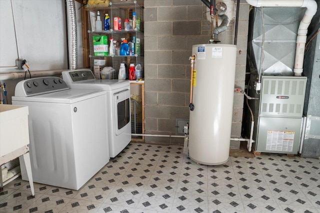 7417 N Hill Rd, Marengo, IL 60152 - laundry area featuring washer and clothes dryer, gas water heater, heating unit, concrete block wall, and light flooring