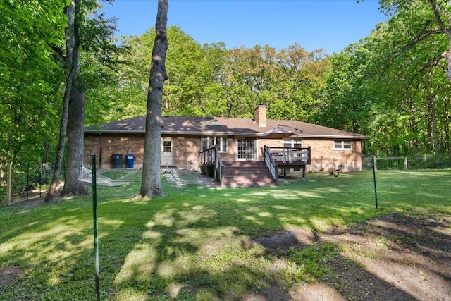 7417 N Hill Rd, Marengo, IL 60152 - back of property featuring stairs, a wooden deck, a chimney, brick siding, and a yard
