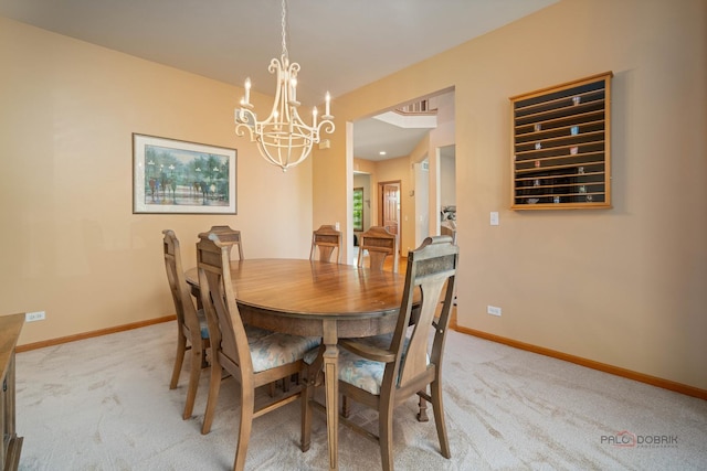 1701 Driftwood Ln, Crystal Lake, IL 60014 - dining space featuring a chandelier, light carpet, and baseboards