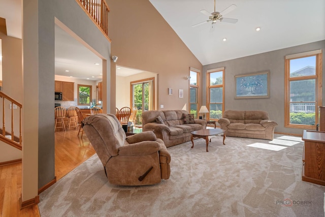 1701 Driftwood Ln, Crystal Lake, IL 60014 - living room with a ceiling fan, high vaulted ceiling, stairs, recessed lighting, and light wood-style flooring