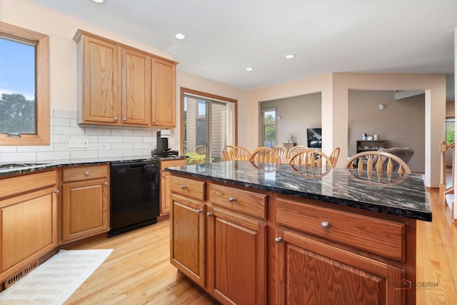 1701 Driftwood Ln, Crystal Lake, IL 60014 - kitchen featuring black dishwasher, light wood-style flooring, tasteful backsplash, recessed lighting, and dark stone counters