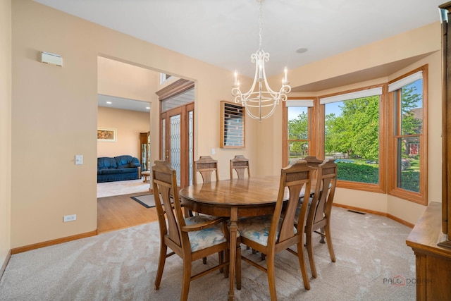 1701 Driftwood Ln, Crystal Lake, IL 60014 - dining room with light colored carpet, baseboards, healthy amount of natural light, and french doors