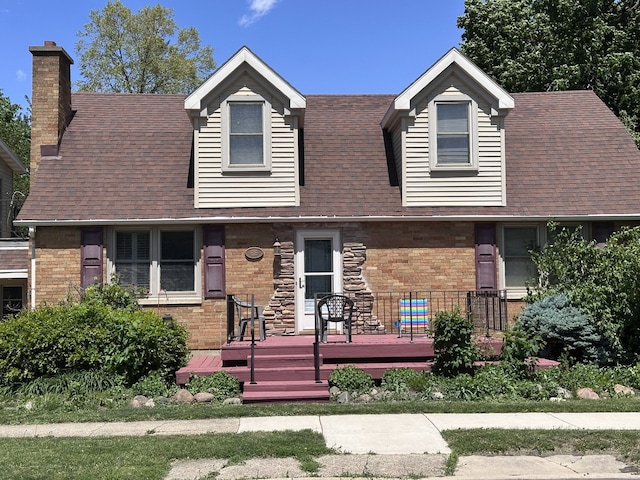 616 E Center St, Ottawa, IL 61350 - view of front facade with a chimney, brick siding, and a shingled roof