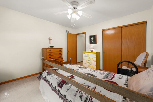 13460 S Magnolia Dr, Plainfield, IL 60544 - bedroom with light carpet, a closet, baseboards, and a ceiling fan