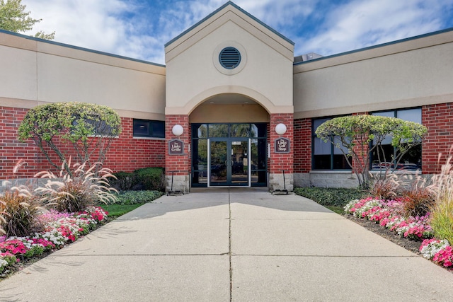 13460 S Magnolia Dr, Plainfield, IL 60544 - property entrance featuring french doors, brick siding, and stucco siding