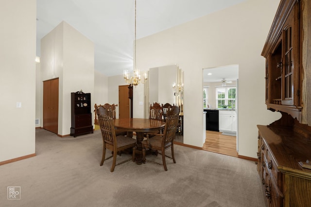13460 S Magnolia Dr, Plainfield, IL 60544 - dining room with light carpet, a chandelier, high vaulted ceiling, baseboards, and ceiling fan