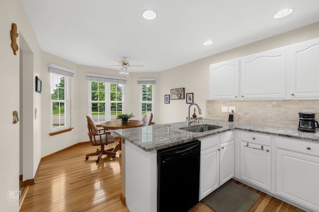 13460 S Magnolia Dr, Plainfield, IL 60544 - kitchen featuring black dishwasher, a sink, a peninsula, ceiling fan, and tasteful backsplash