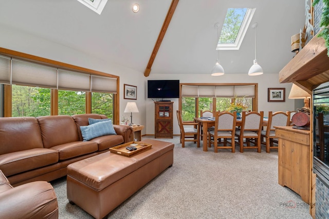4308 Miller Oaks Dr, Mchenry, IL 60051 - carpeted living room featuring a skylight, high vaulted ceiling, and beam ceiling