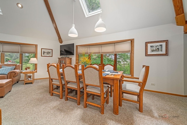 4308 Miller Oaks Dr, Mchenry, IL 60051 - dining room featuring a skylight, carpet flooring, and baseboards
