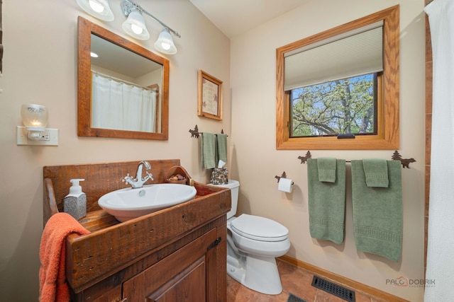 4308 Miller Oaks Dr, Mchenry, IL 60051 - bathroom with vanity, toilet, and baseboards
