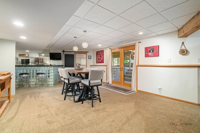 4308 Miller Oaks Dr, Mchenry, IL 60051 - dining area with carpet floors, a bar, baseboards, and recessed lighting
