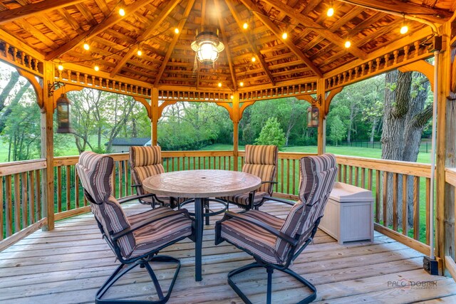 4308 Miller Oaks Dr, Mchenry, IL 60051 - deck with a gazebo, outdoor dining area, and view of scattered trees