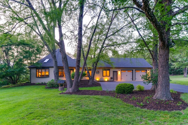 4308 Miller Oaks Dr, Mchenry, IL 60051 - view of front of property with a front lawn, driveway, an attached garage, and stucco siding