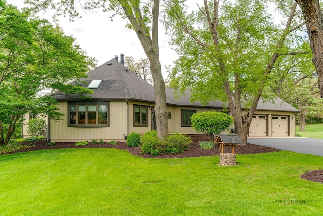 4308 Miller Oaks Dr, Mchenry, IL 60051 - view of front of property featuring roof with shingles, driveway, a front lawn, and an attached garage