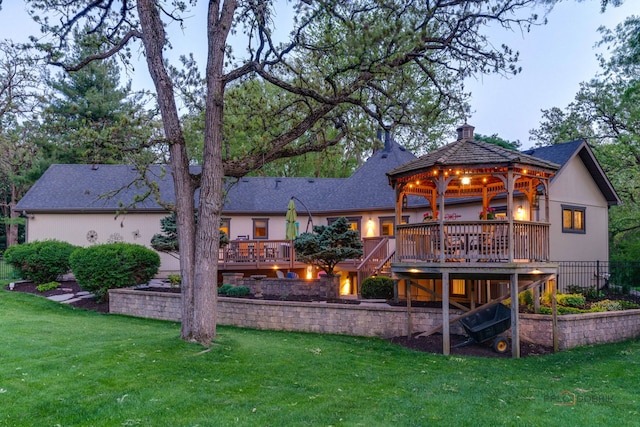 4308 Miller Oaks Dr, Mchenry, IL 60051 - rear view of property with a gazebo, a wooden deck, a chimney, and stucco siding