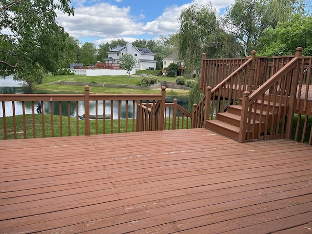 122 San Carlos Rd, Minooka, IL 60447 - wooden deck featuring a water view, stairway, and a yard