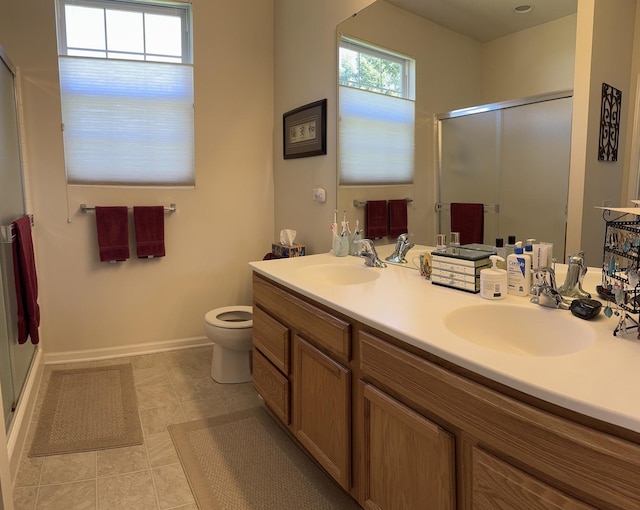 13370 Red Alder Ave, Huntley, IL 60142 - bathroom featuring a shower stall, double vanity, toilet, and baseboards