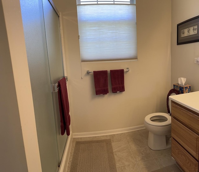 13370 Red Alder Ave, Huntley, IL 60142 - bathroom featuring a stall shower, vanity, baseboards, toilet, and tile patterned floors